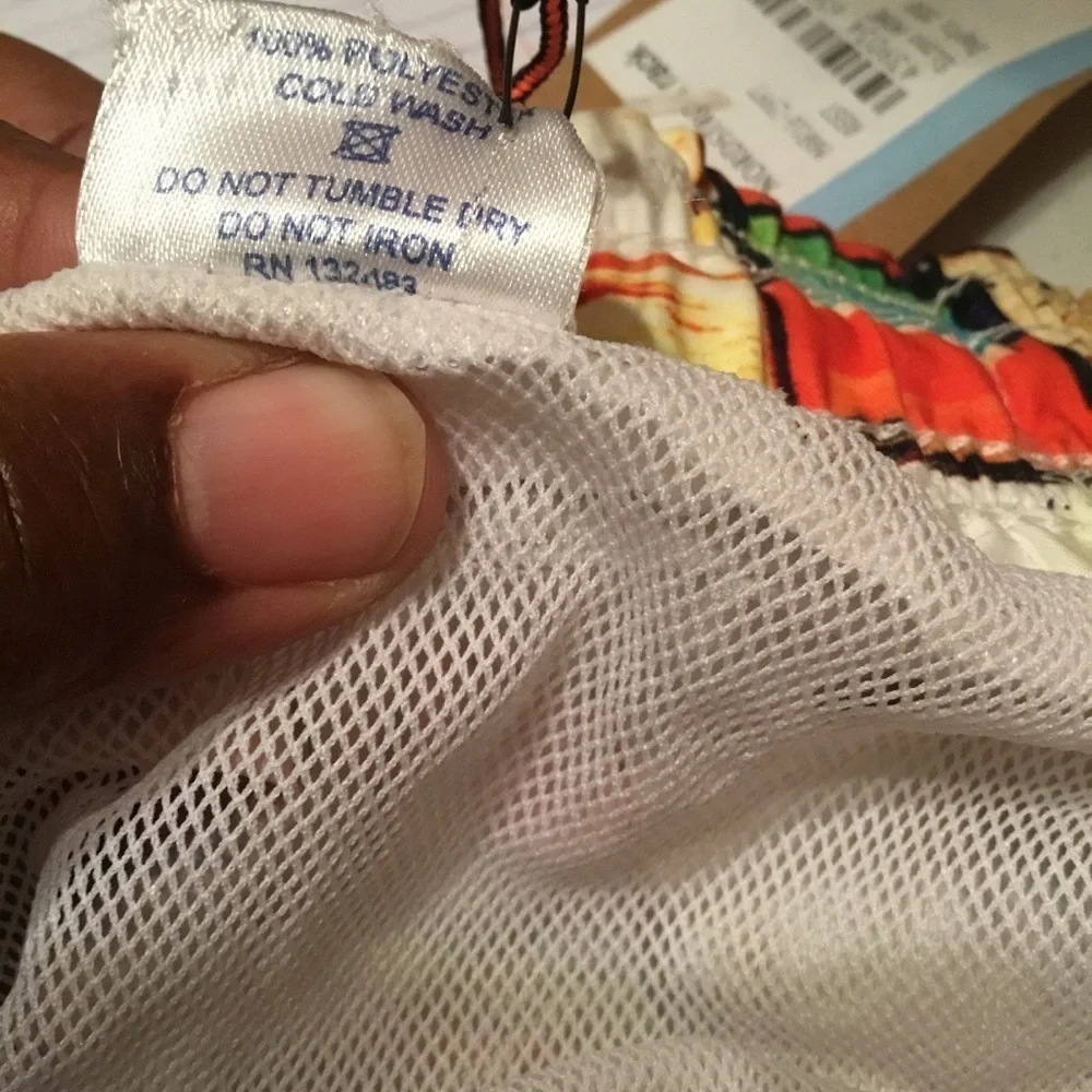 Spenglish tropical swim trunks.